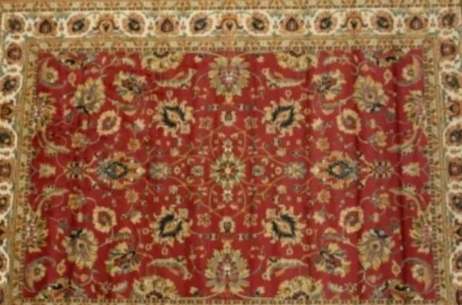 A Persian-style rug with a red background and intricate floral patterns in beige, navy, and green.