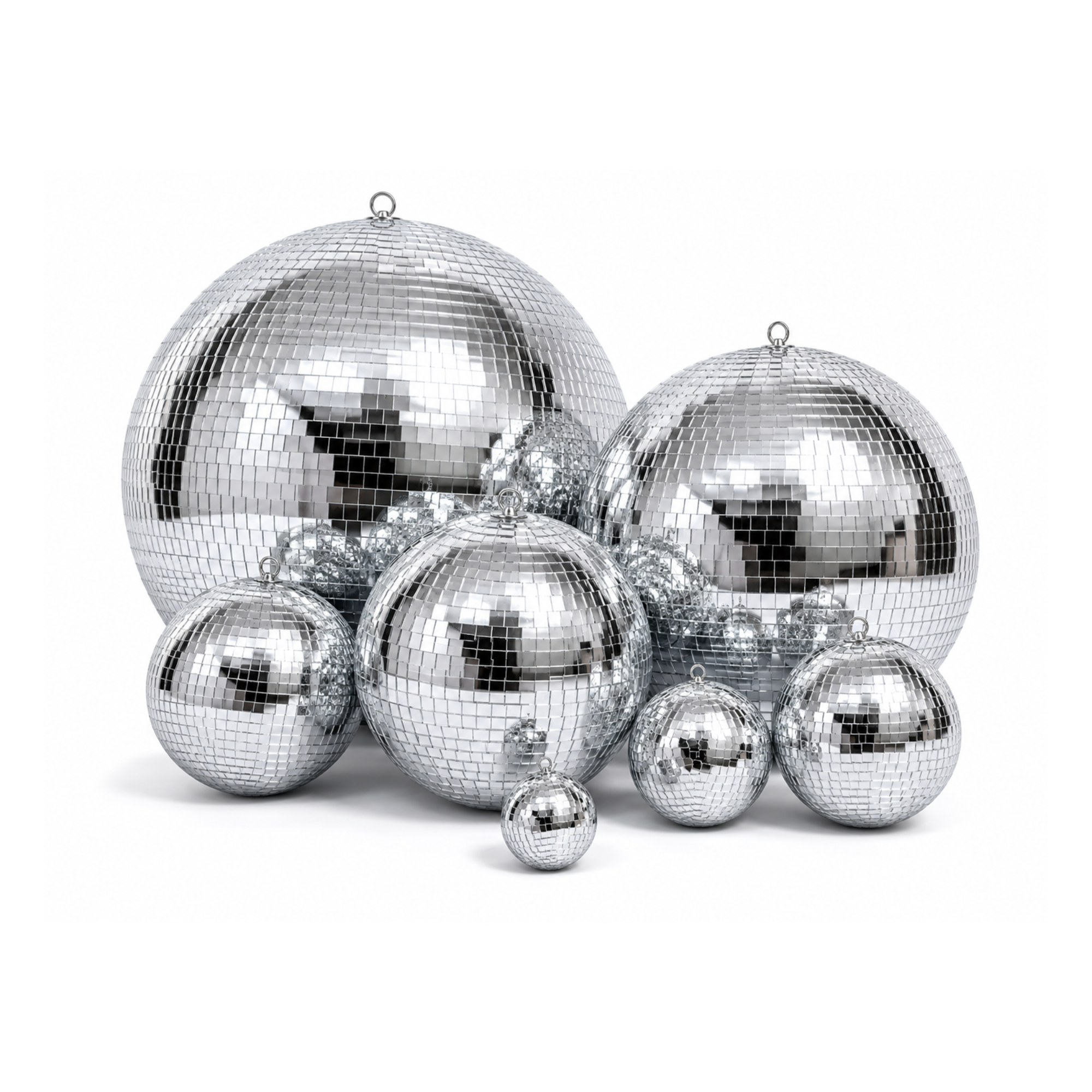 Multiple disco balls of various sizes reflecting light, set against a white background.