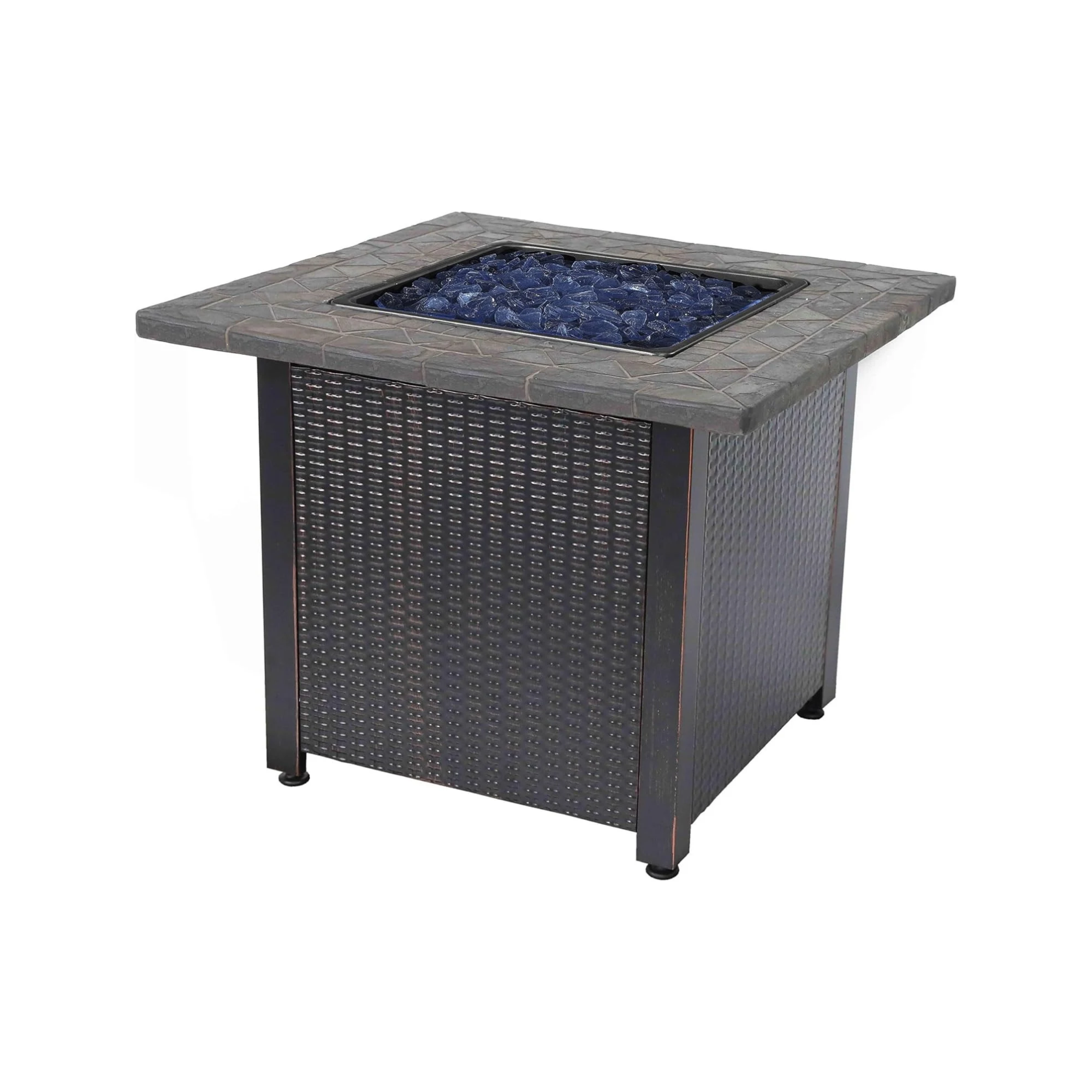 A fire pit table with a square top surrounded by a stone paver surface, filled with glass stones.