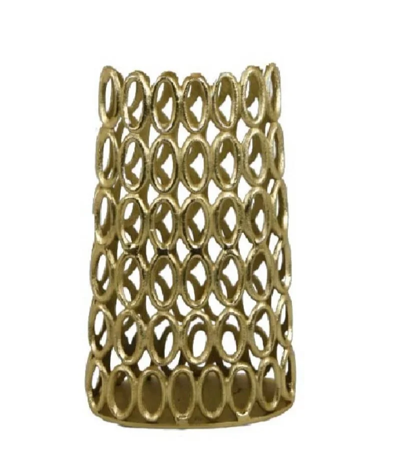 A gold-colored, openwork cylindrical bracelet with oval and circular cutouts.