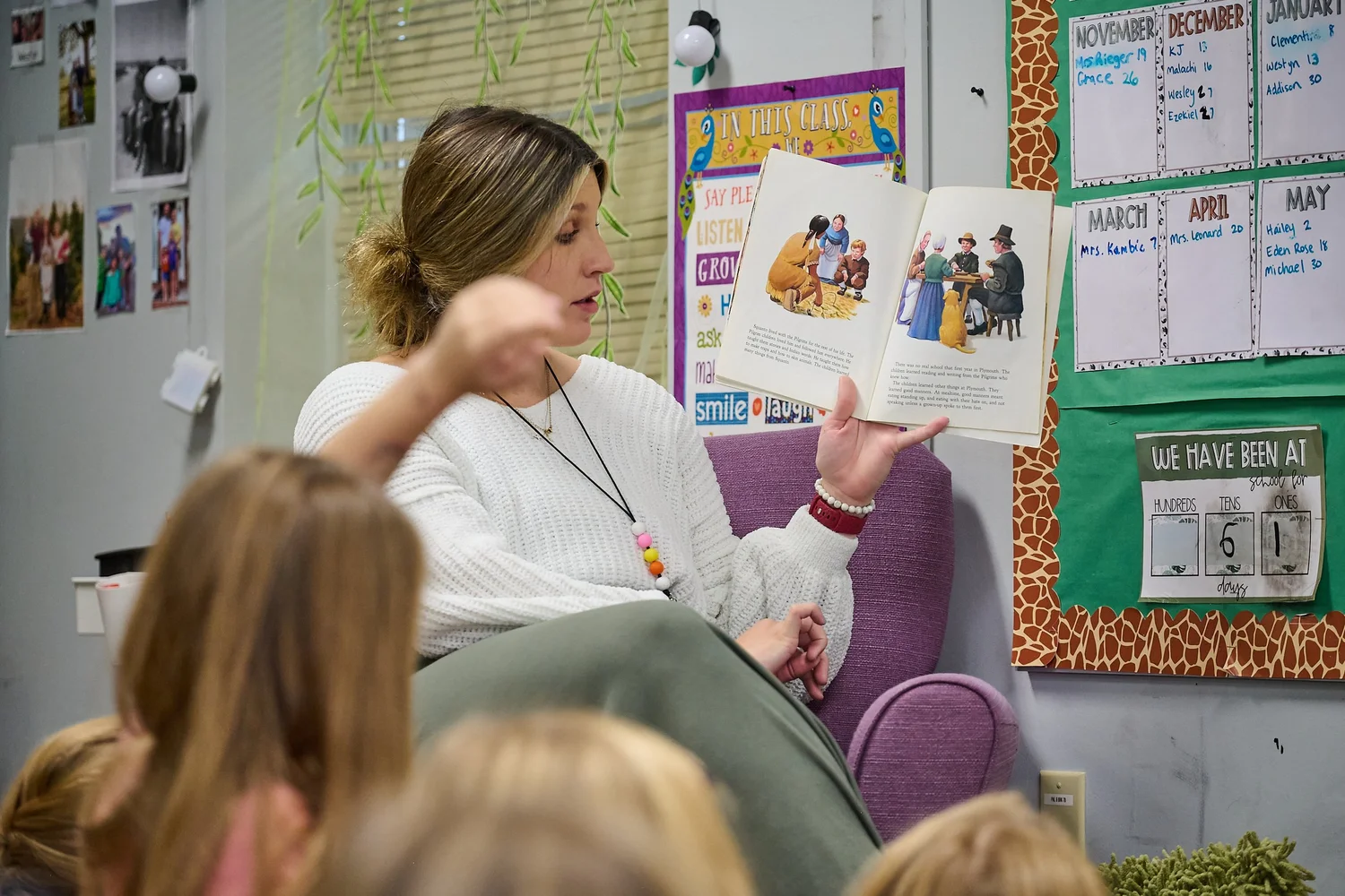 An LCCS teacher reading aloud to her class