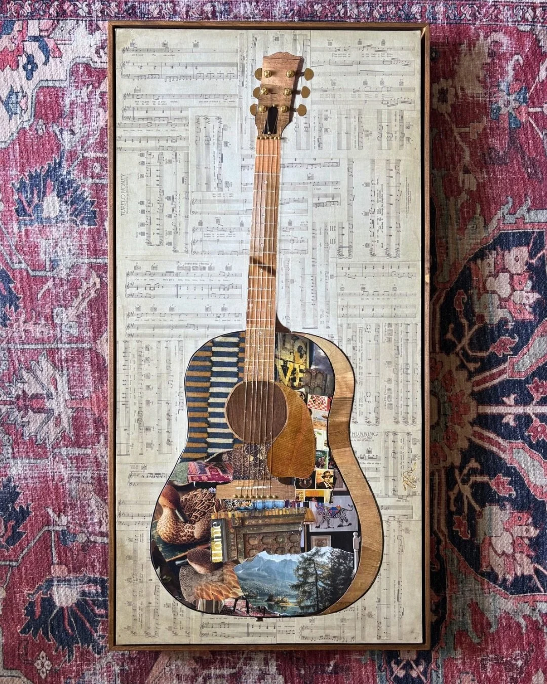 Meet Sophia. This piece was created as a wedding gift for our nephew and his bride. Inspired by a Gibson guitar, it&rsquo;s made from repurposed magazines and fabric scraps on a 20&rdquo; x 40&rdquo; wood panel. The background is layered with sheet m