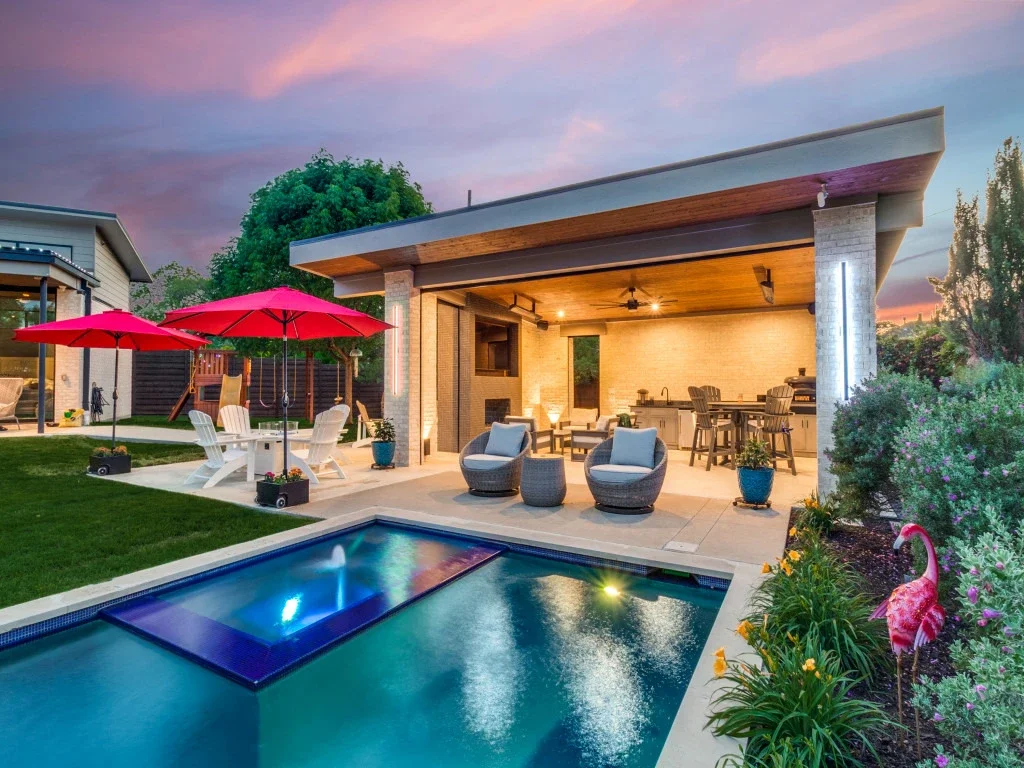 Patio cover with a kitchen, bathroom, pool, and spa.