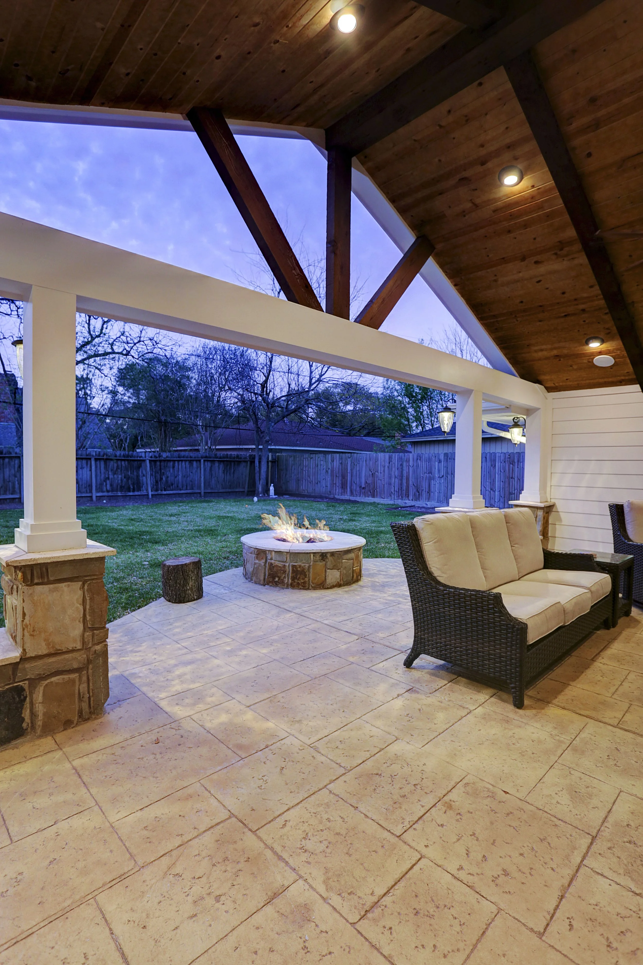 Covered Patio with Stamped Concrete and Fire Pit for Cozy Outdoor Living