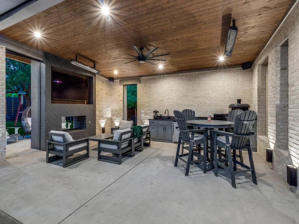 This patio cover with retractable screens make hanging outdoors comfortable.