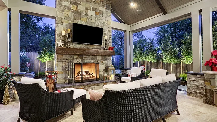 Beautiful full masonry stone fireplace with reclaimed mantel and TV