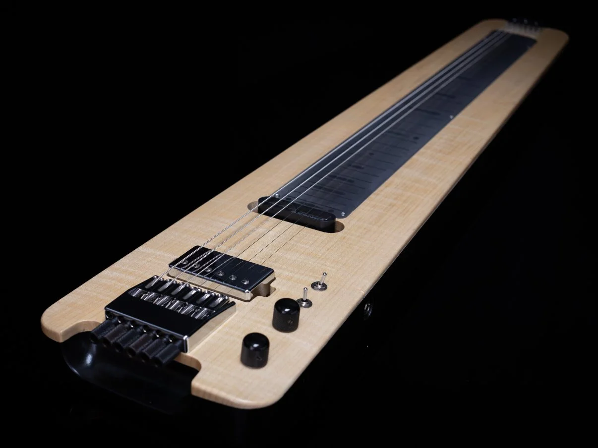 A modern sleek headless lapsteel, chrome hardware, stainless steel fret marker board - 3/4 view