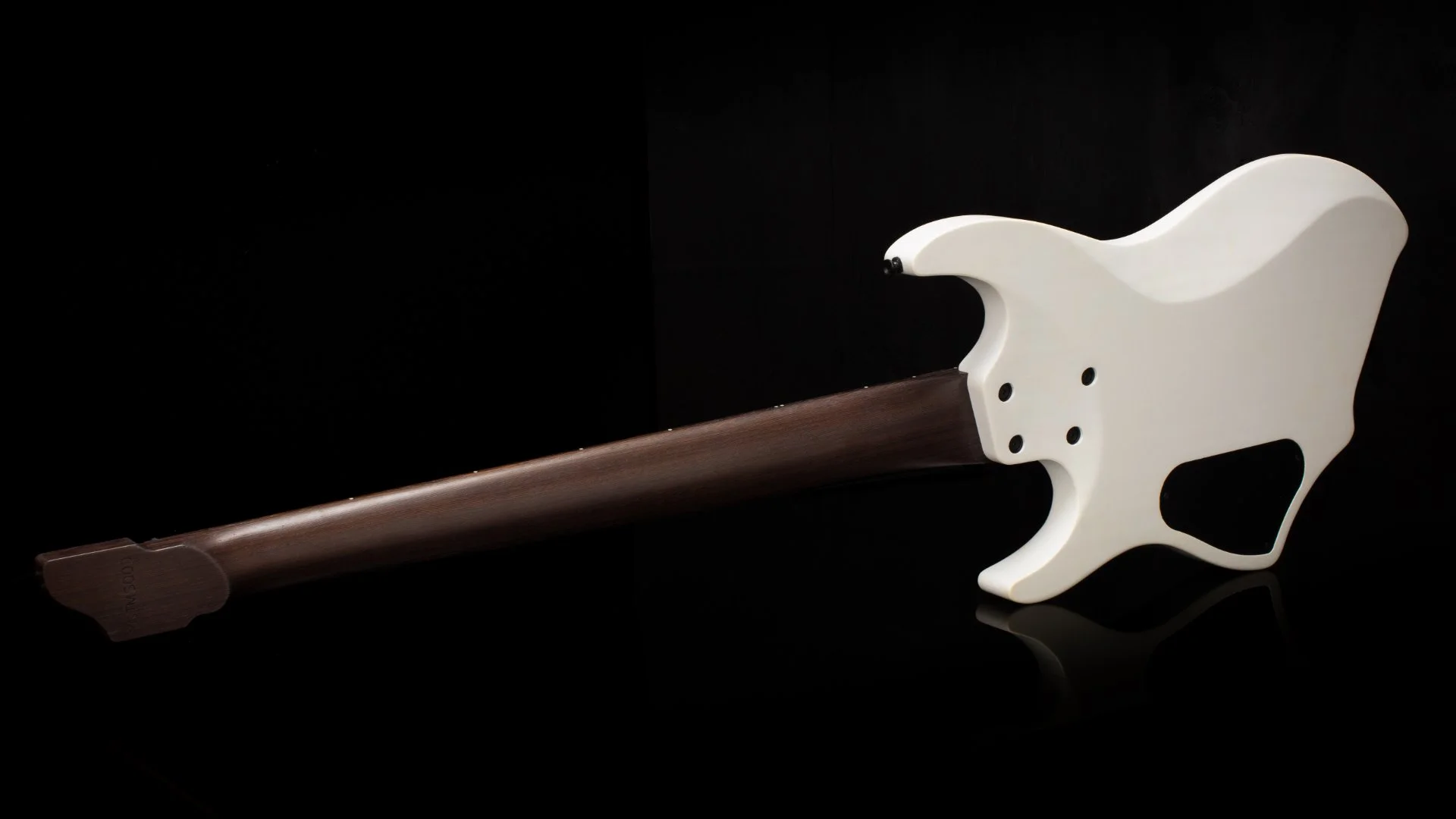 Back view of a white 5 string headless multiscale bass focussing on the african wenge neck