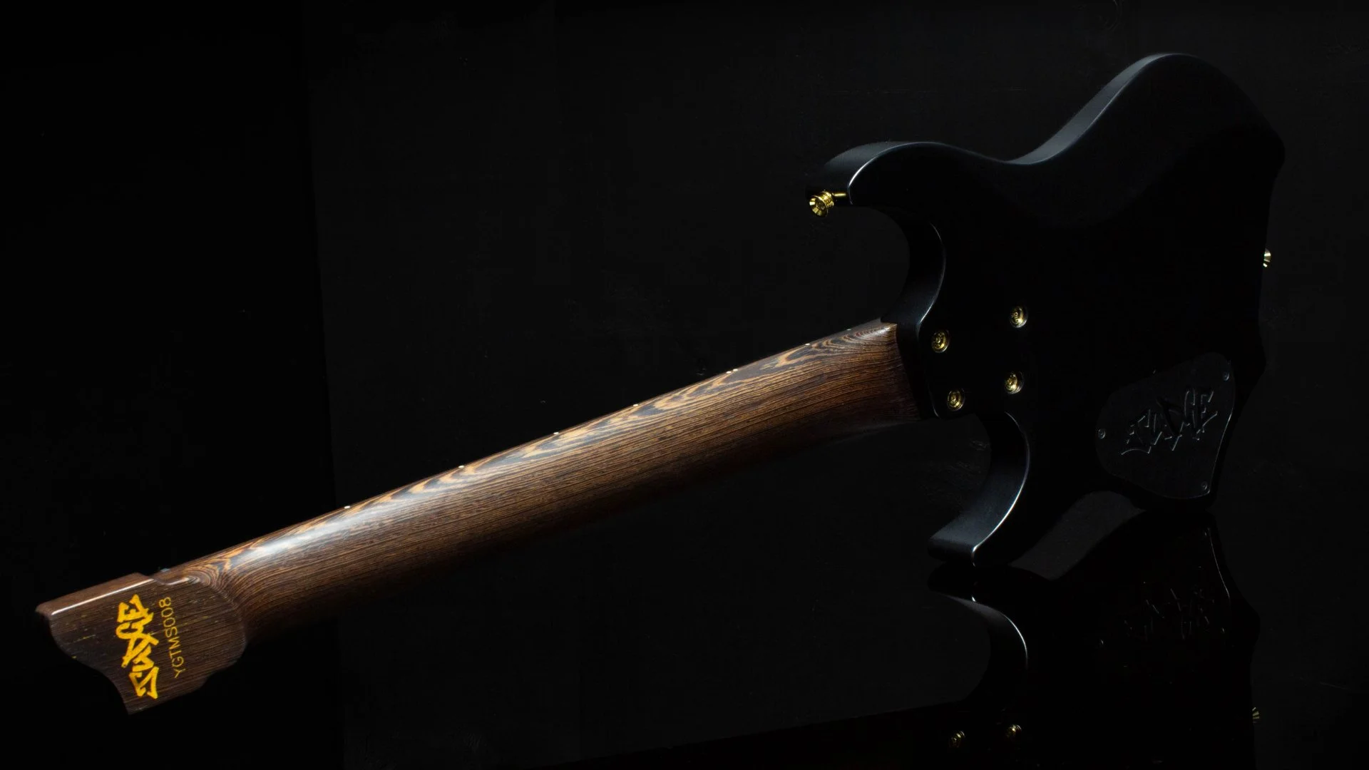 A black 7 string headless - multiscale electric guitar featuring the 'JUDGE' logo