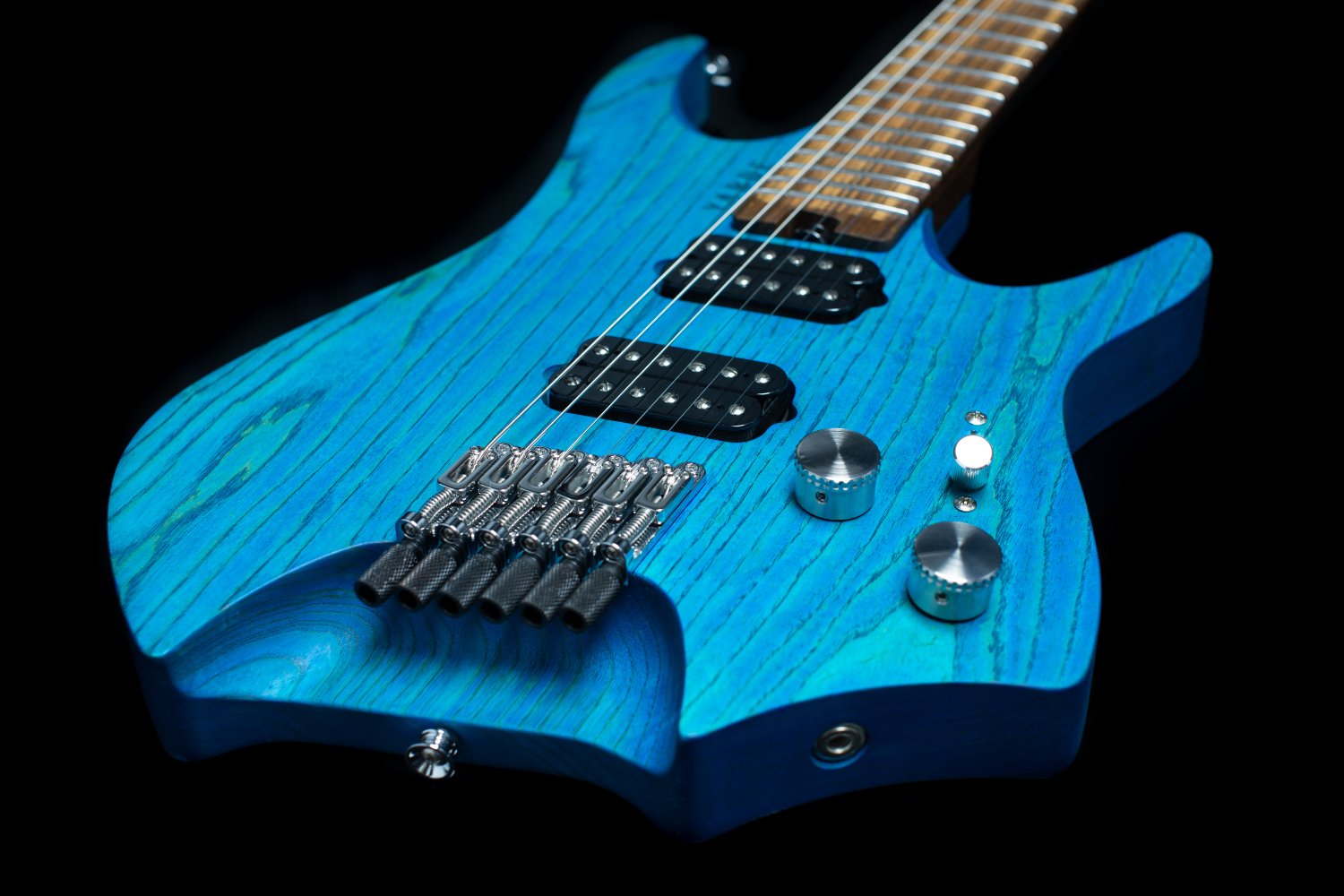 Blue stained headless - multiscale electric guitar focussing on the chrome hardware and custom humbucker pickups