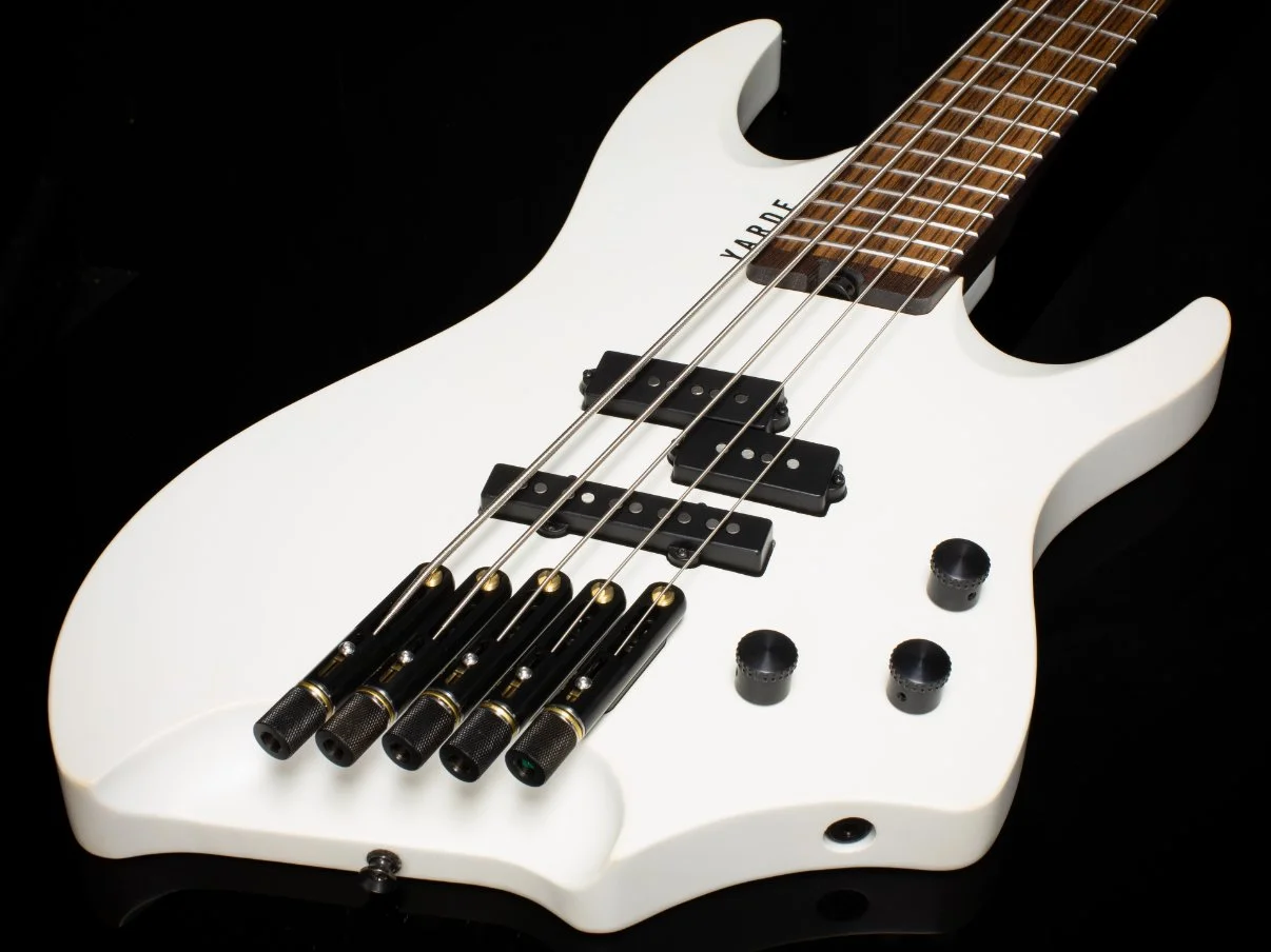 3/4 view of the white 5 string body with black hardware