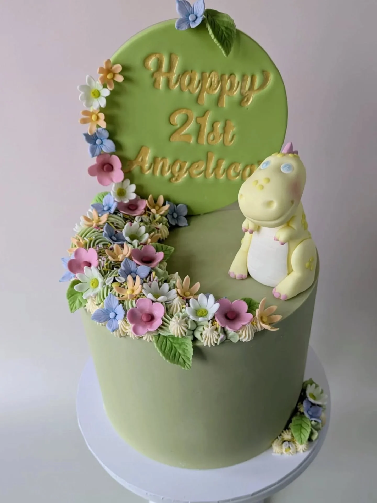 Angelica's mum came to me with one very clear brief. Make her daughter's 21st unforgettable.

Angelica loves pastels, she loves flowers and she loves dinosaurs. So that was exactly what she got. Every single flower on this cake is hand made by yours 