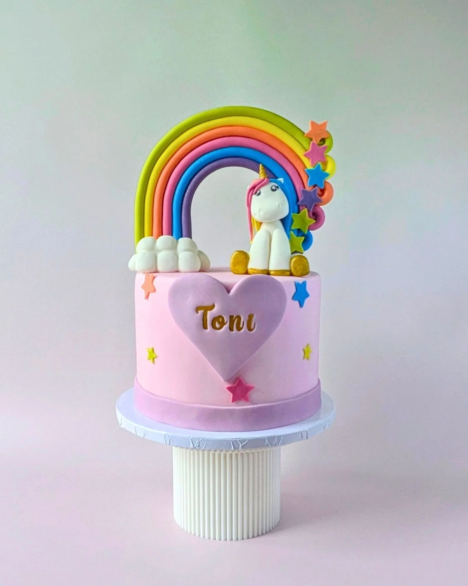 kids vegan unicorn and rainbow themed birthday cake.