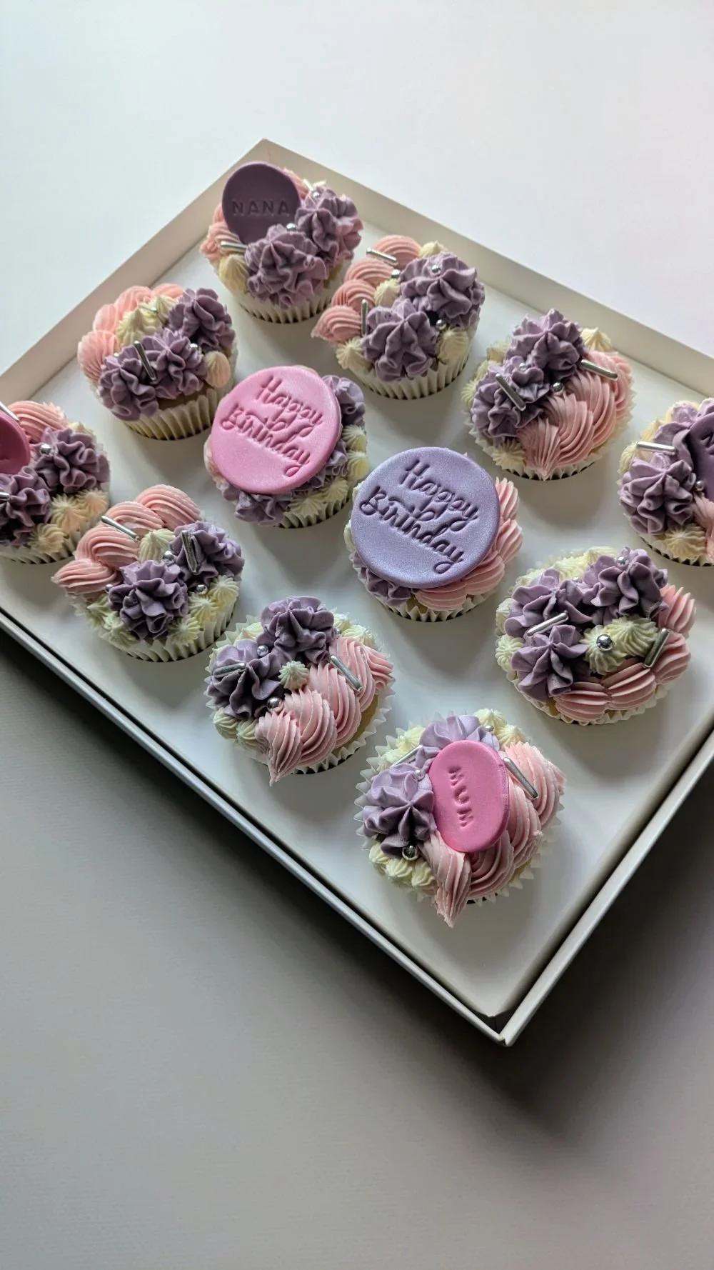Vegan cupcakes with pink and purple buttercream swirls and Mum Nana message toppers, Bristol vegan cake shop