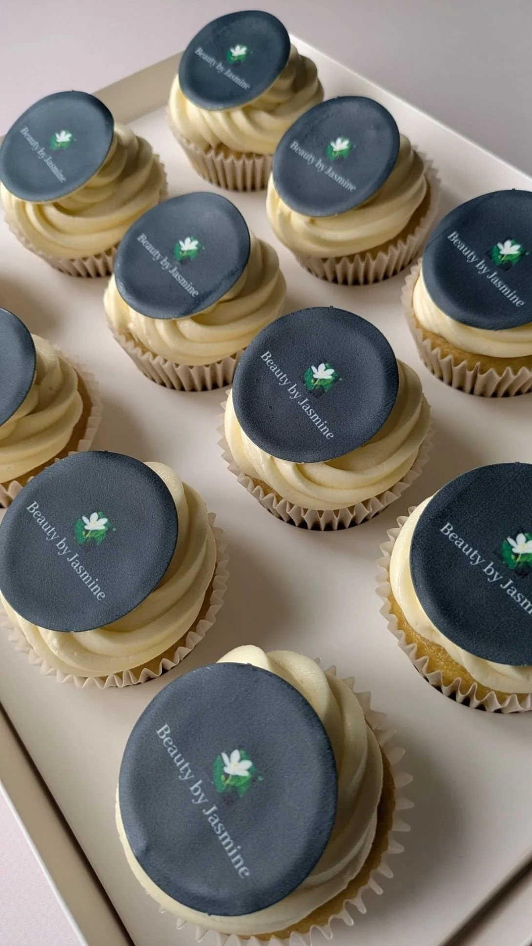 vanilla vegan cupcakes with business logo on them Bristol