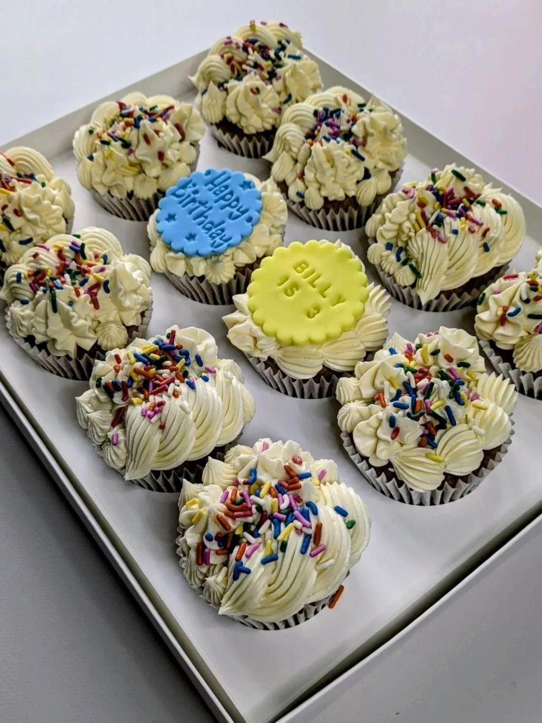 White vegan vanilla cupcakes with multicoloured sprinkles Bristol