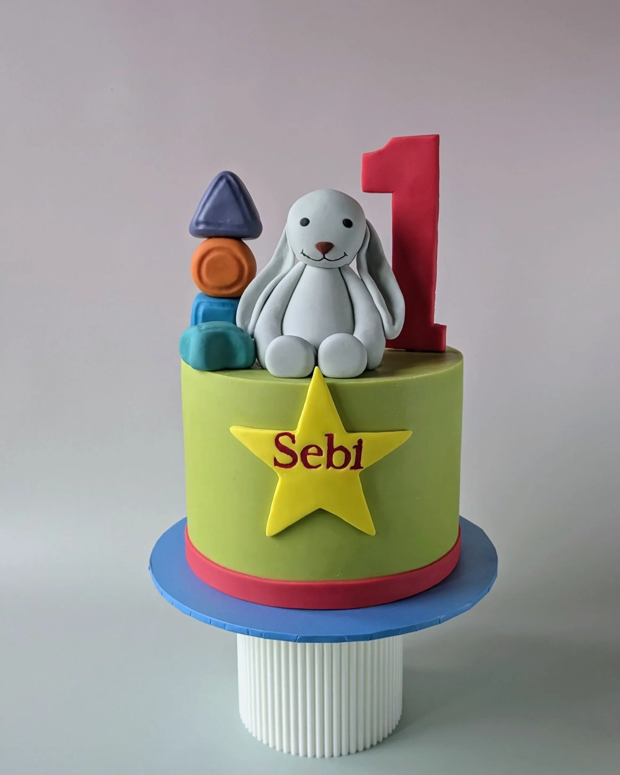 Green celebration cake with handmade bunny rabbit and number block topper, celebration cakes Bristol