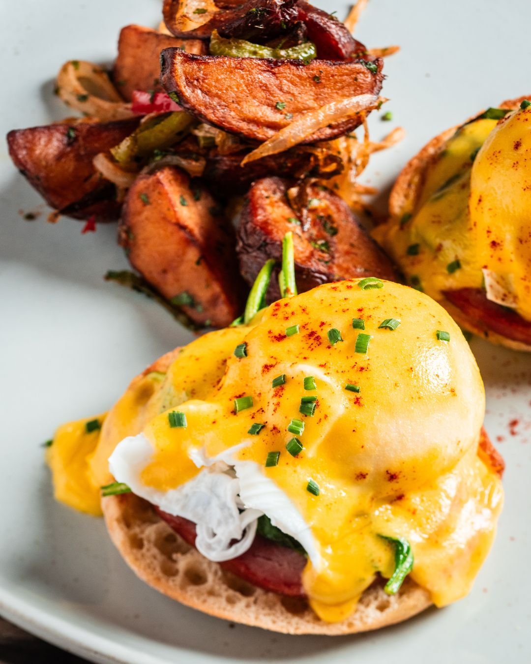 Breakfast classics, elevated. 

Poached eggs, smoked paprika and hollandaise, and your choice of protein: Canadian bacon or smoked salmon.