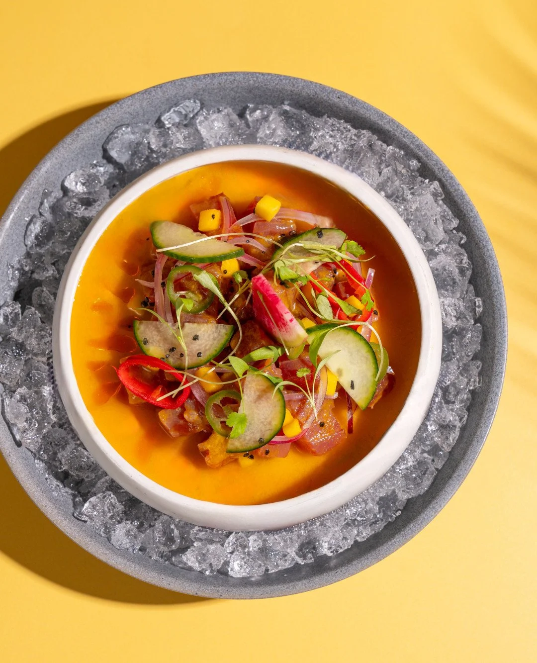 A show-stopping start: our ceviche amarillo features mango melcocha sauce, and a hint of chili powder for the perfect balance of bright, fresh, heat.