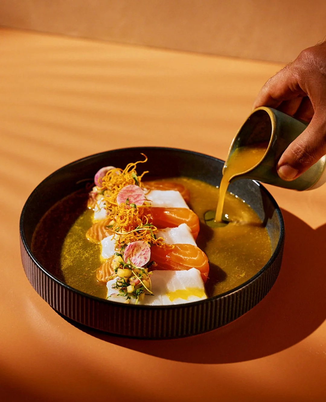 Our Luz de Mar Tiradito celebrates the warm early morning glow of the sunrise with saffron aguachile and a mango relish, and marigold to compliment salmon, seabass, and crispy sweet potato. 

Part of our D&iacute;a de los Muertos culinary collection,