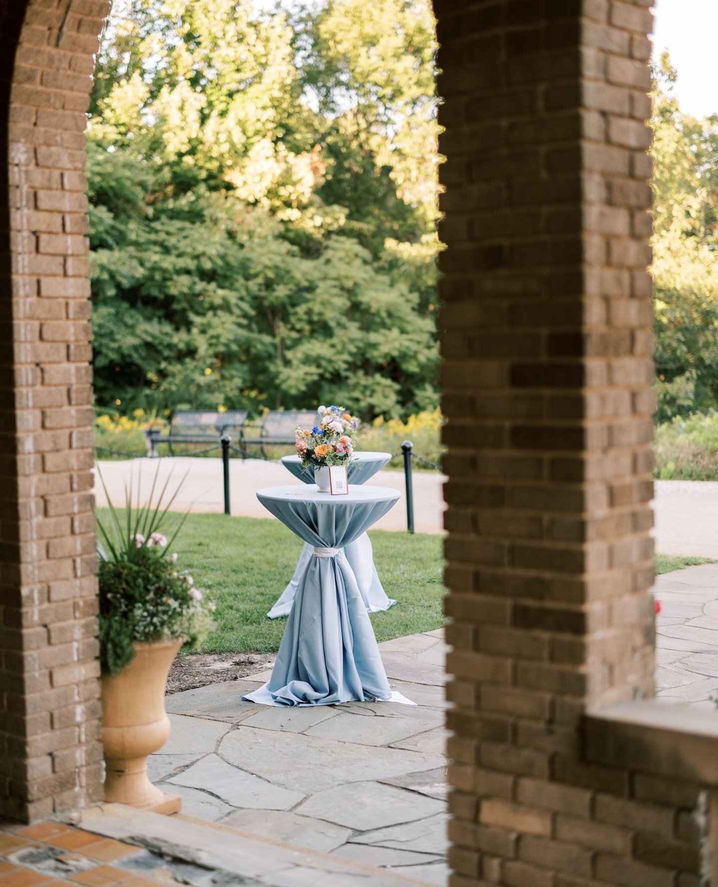 Having an outdoor cocktail hour? On a hot, summer day guests will appreciate a shaded area to mingle while they enjoy their cocktails and hors d'oeuvres. Don't forget a sash for the cocktail tables or heavy linen to keep the wind from blowing the lin