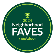 A circular badge with a green border and background, featuring a trophy icon with '2024 Neighborhood FAVES' and the 'nextdoor' logo.