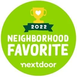 A green circular badge with a gold trophy at the top, reads '2022 Neighborhood Favorite' from nextdoor.