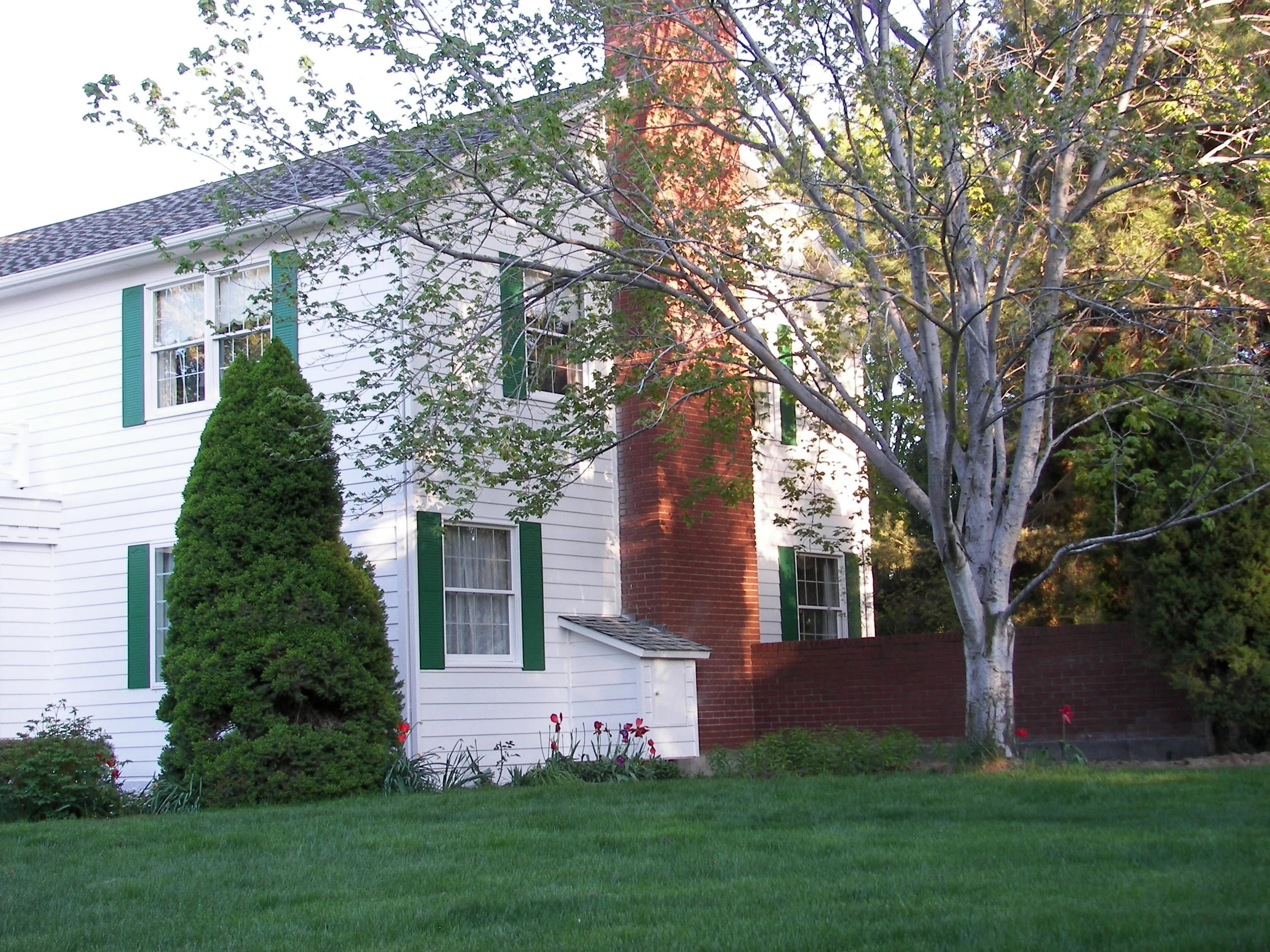Boise Bench Exterior white and green house with brick chimney