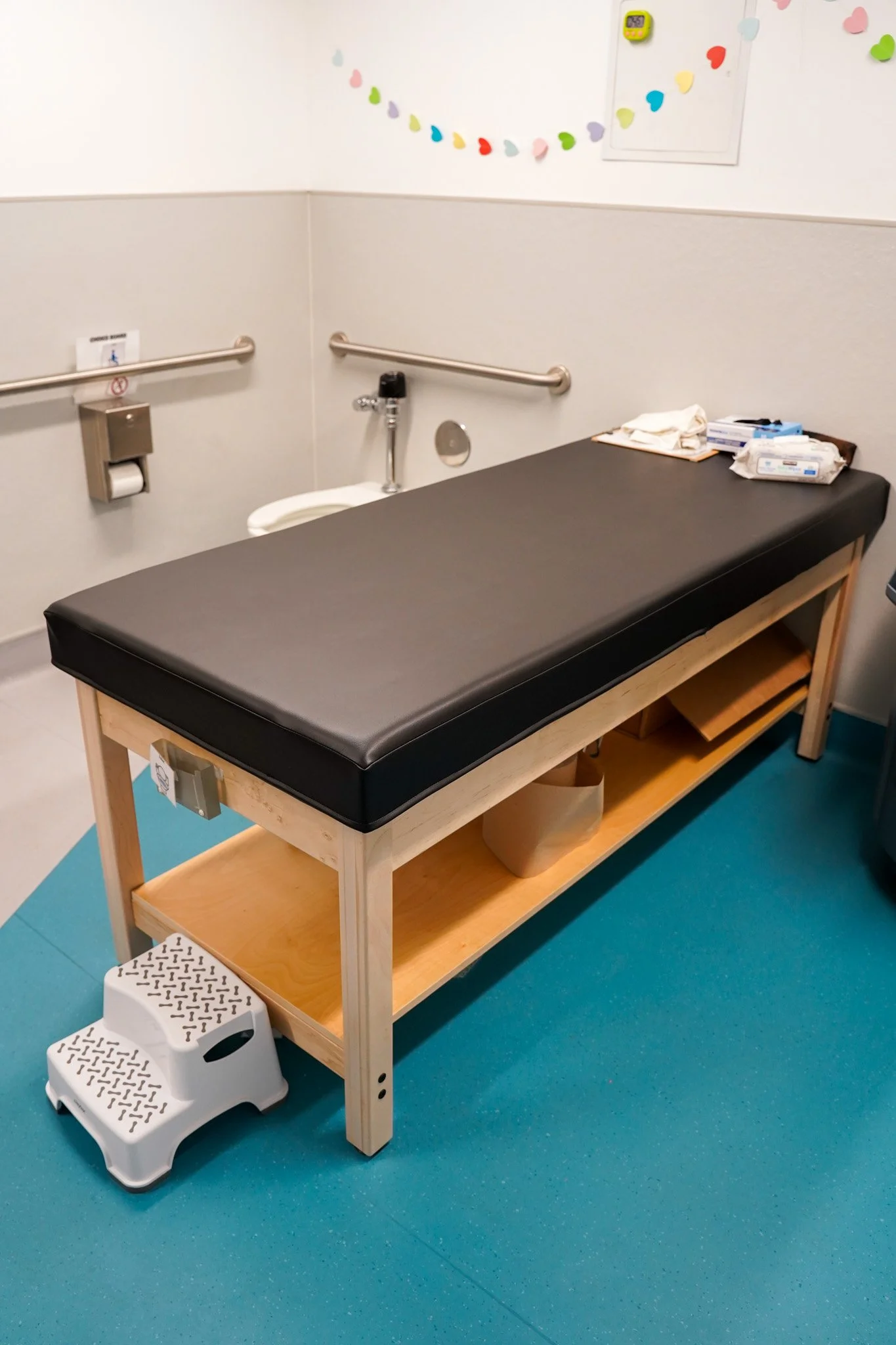 This large changing table is used in elementary and special needs bathrooms. 