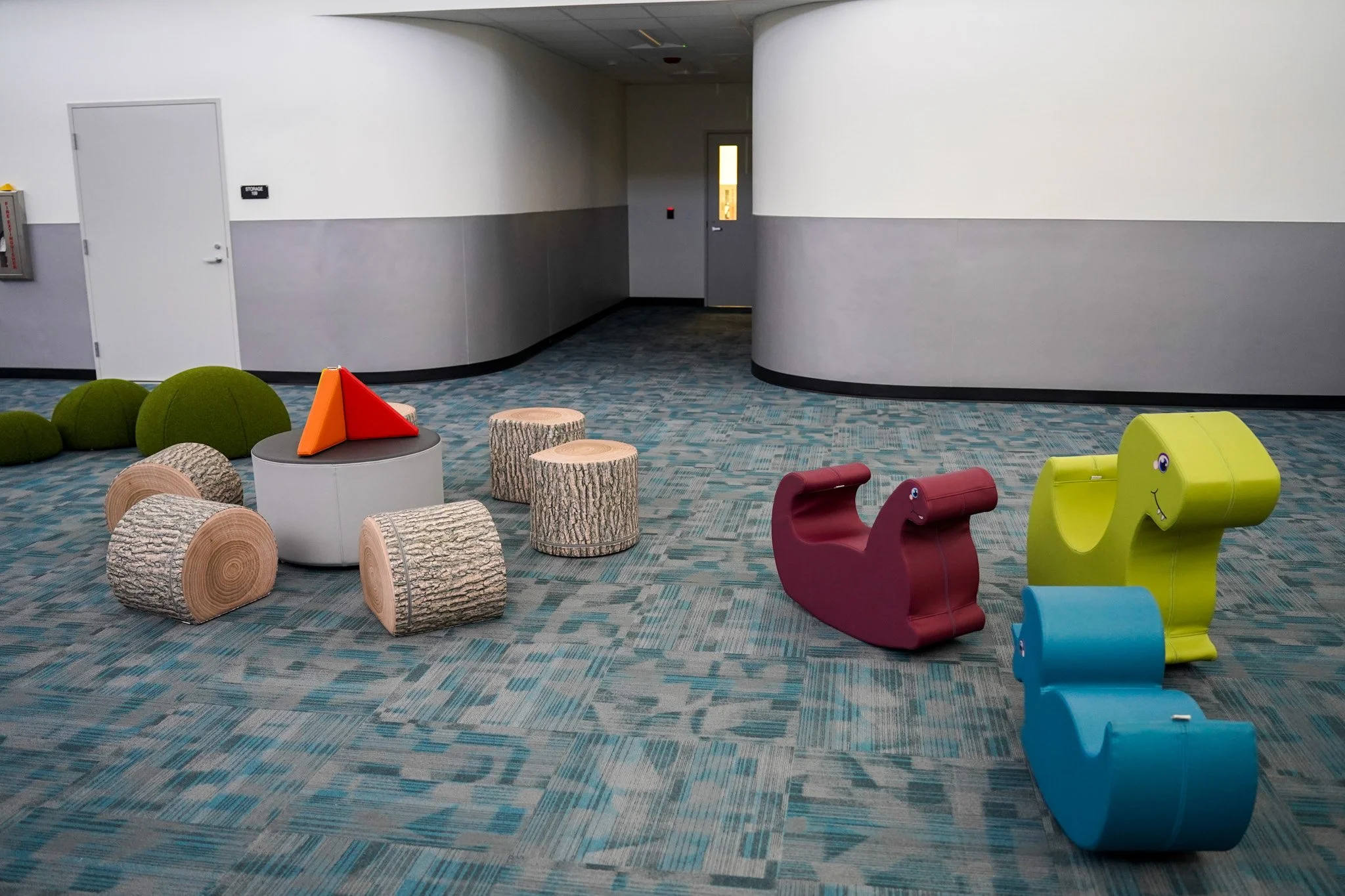 The campus's "Breakout Room" where students can play on soft seating. 