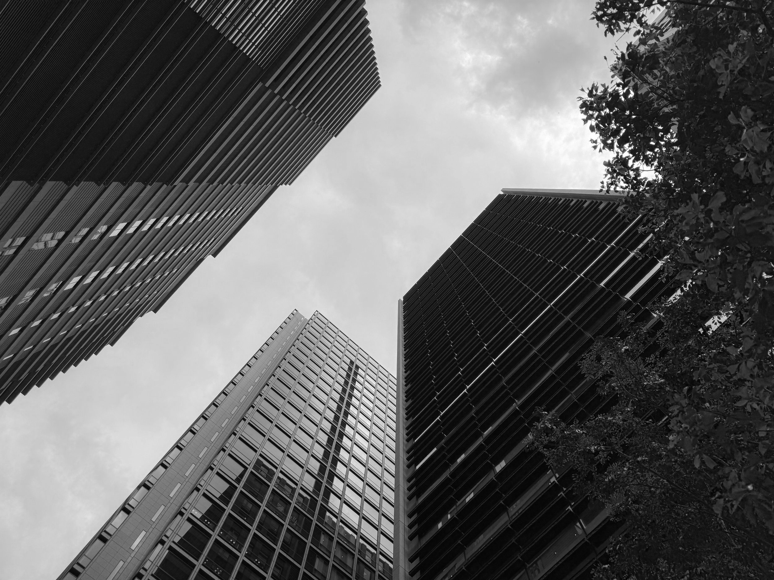 A-group-of-tall-buildings-with-a-sky-background-2469117.jpg