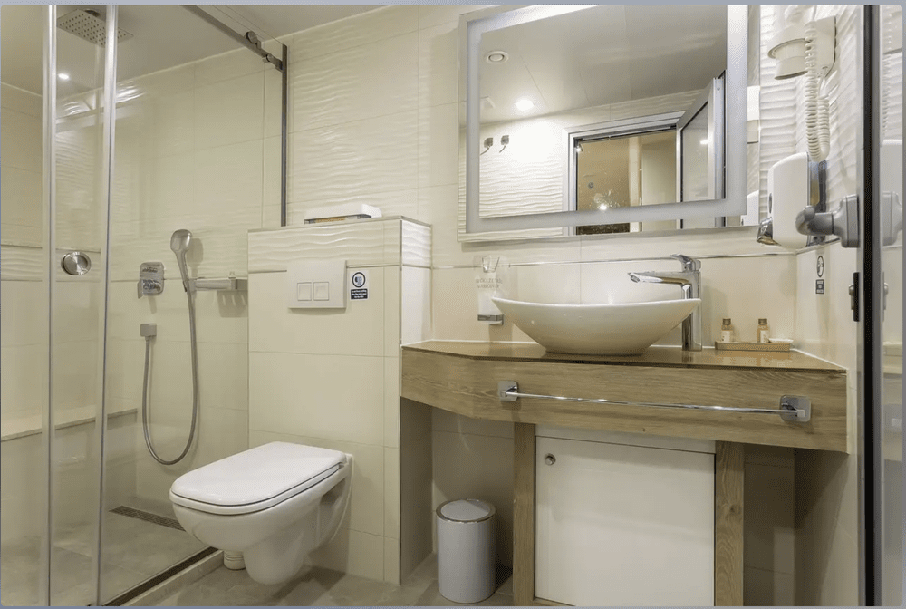 Ensuite yacht cabin bathroom with glass shower
