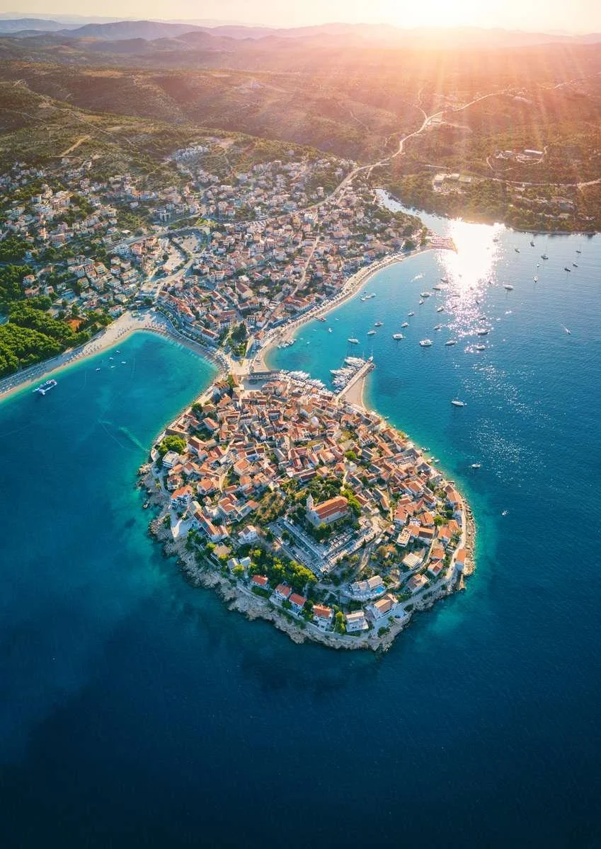 Aerial view of a historic peninsula town on Croatia's Dalmatian Coast