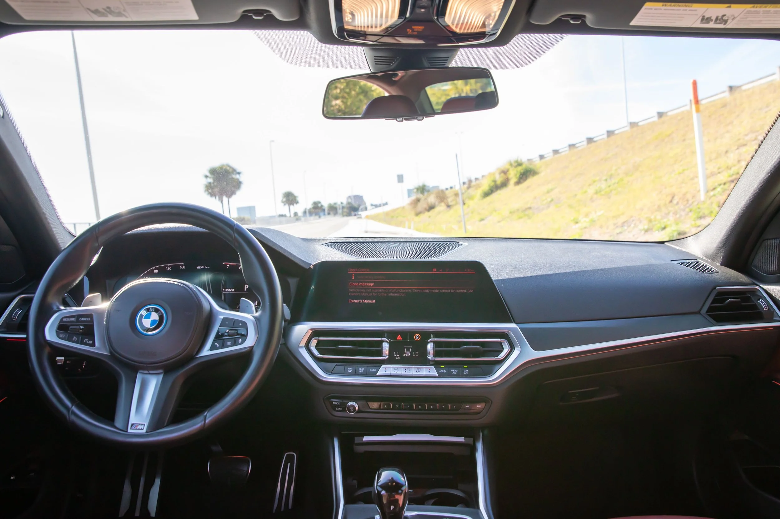 Grey 2022 BMW 330E along Courtney Campbell Causeway, Tampa FL.