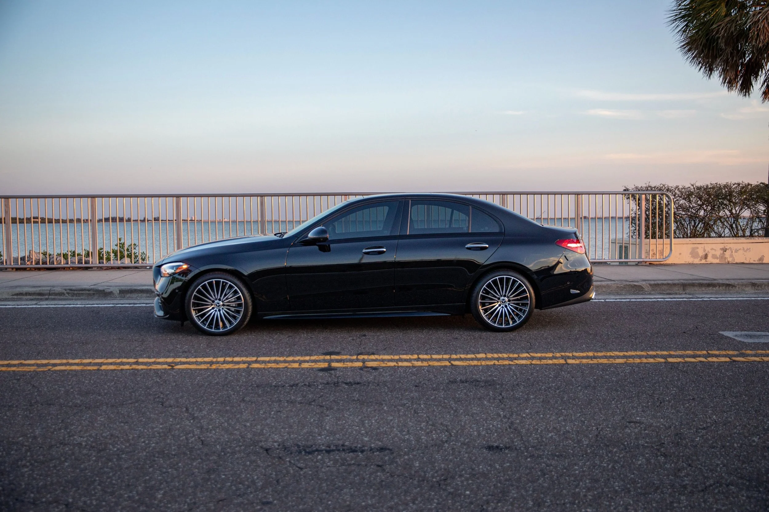 Black 2023 mercedes C300 along Courtney Campbell Causeway, Tampa FL.