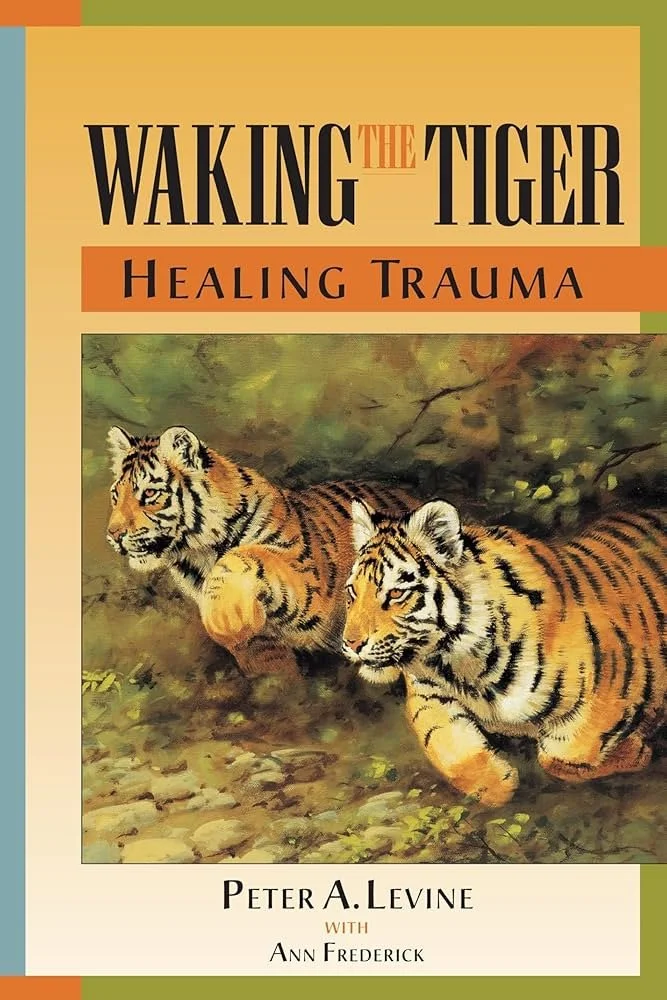 Book cover titled "Waking the Tiger: Healing Trauma" by Peter A. Levine with Ann Frederick, and offering somatic experiencing counseling, and counseling for trauma, and counseling for anxiety, and anxiety counseling, and trauma counseling.