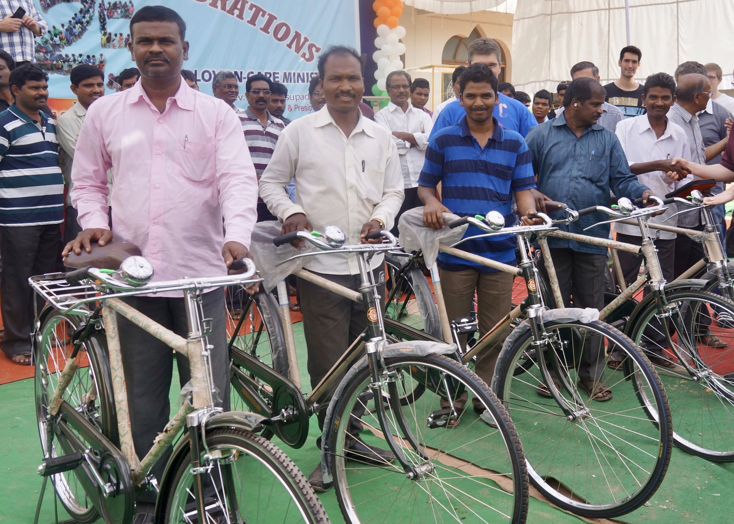 Pastors_receiving_bicycles.jpeg
