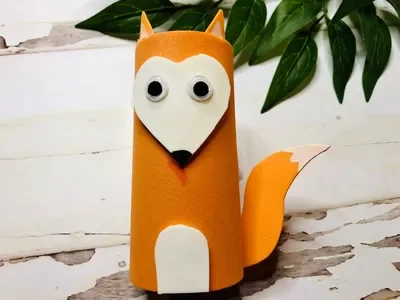 An orange cardboard tube fox