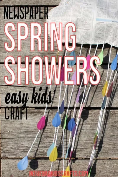 A cloud mobile with rainbow rain drops and the title textnewspaper Spring Showers easy kids craft