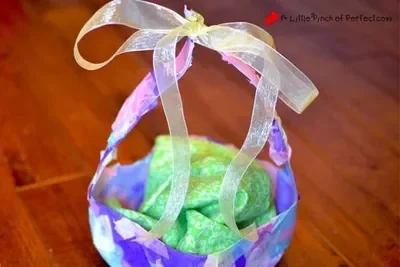 A purple, blue and pink easter basket with