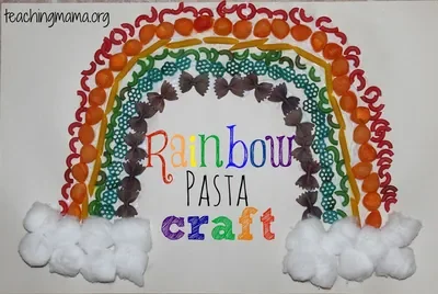 A rainbow made from dyed pasta with cotton balls clouds