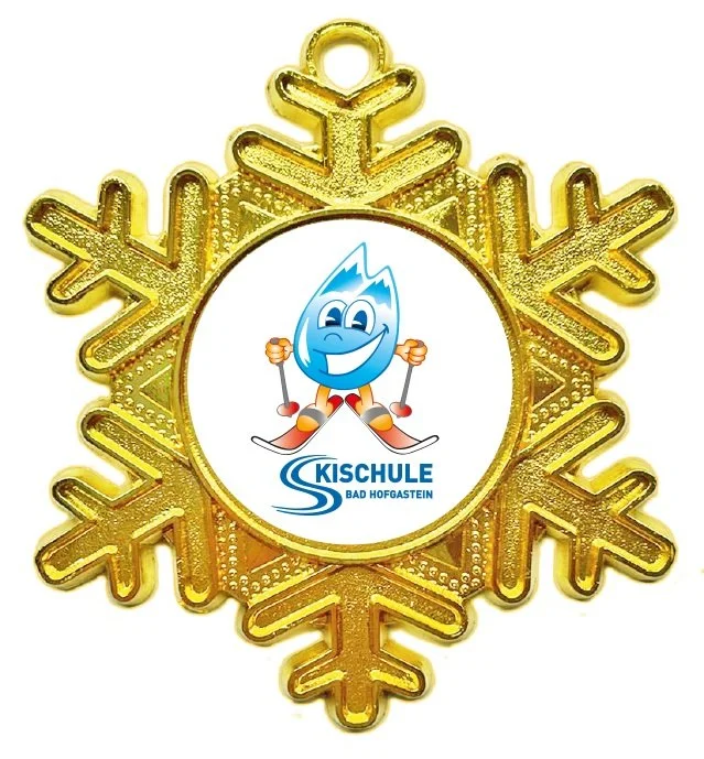 Goldmedaille mit einem lustigen Maskottchen-Charakter Gasti in Skiausrüstung und Skischule Bad Hofgastein-Logo in der Mitte.