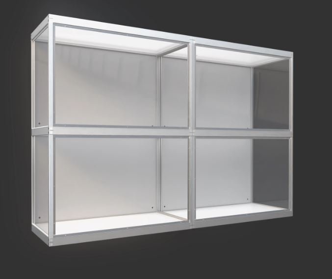 Metal-framed display case with four glass or acrylic compartments against a dark background.