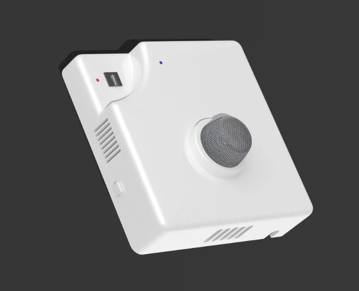 A white intercom or microphone device with a large round speaker, small indicator lights, and a USB port on a dark gray background.
