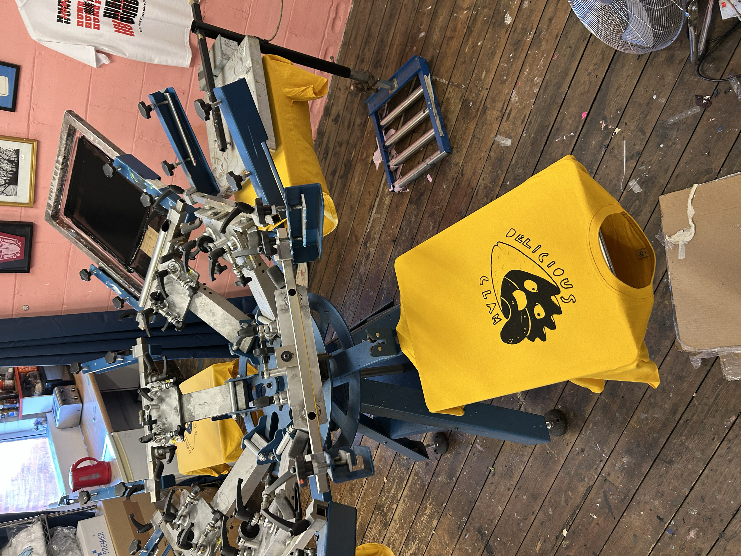 Bold yellow tees for Delicious Clam.