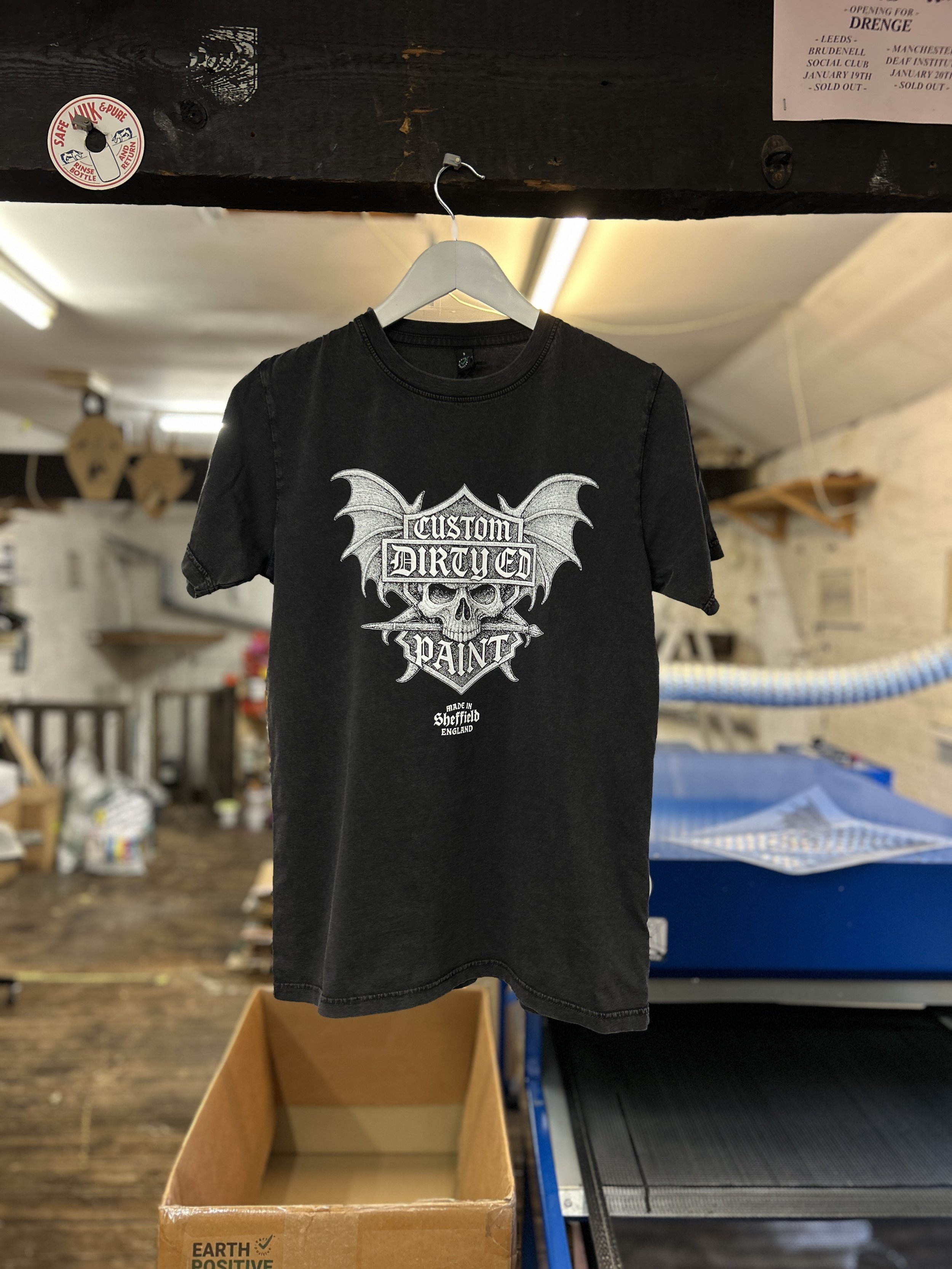 A great combination of a highly detailed print on to washed black tees gives a vintage, worn in effect.