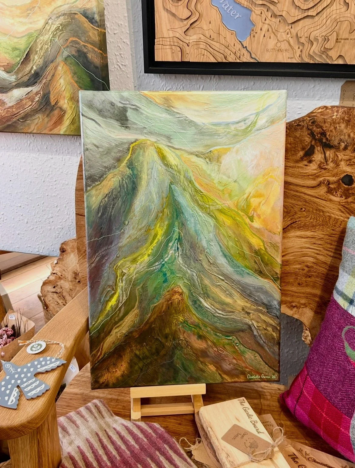 A lovely new piece from Charlotte Gurran has arrived in the gallery!⛰️✨

&bull;

This piece really glimmers in the light, with iridescent layers of soft greens, blues and warm golden tones moving across the canvas. Charlotte&rsquo;s flowing lines and