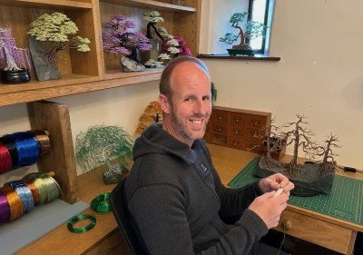 Handmade wire bonsai tree sculpture by Twisted Wonders, mounted on Lakeland slate and available at Pole Star Gallery in Keswick.