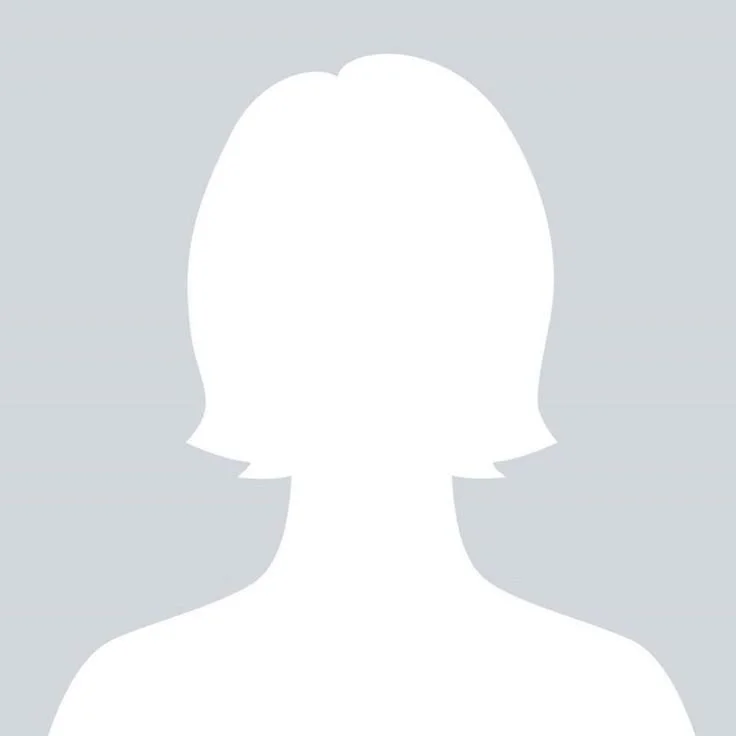 Silhouette of a person with short hair against a light gray background.
