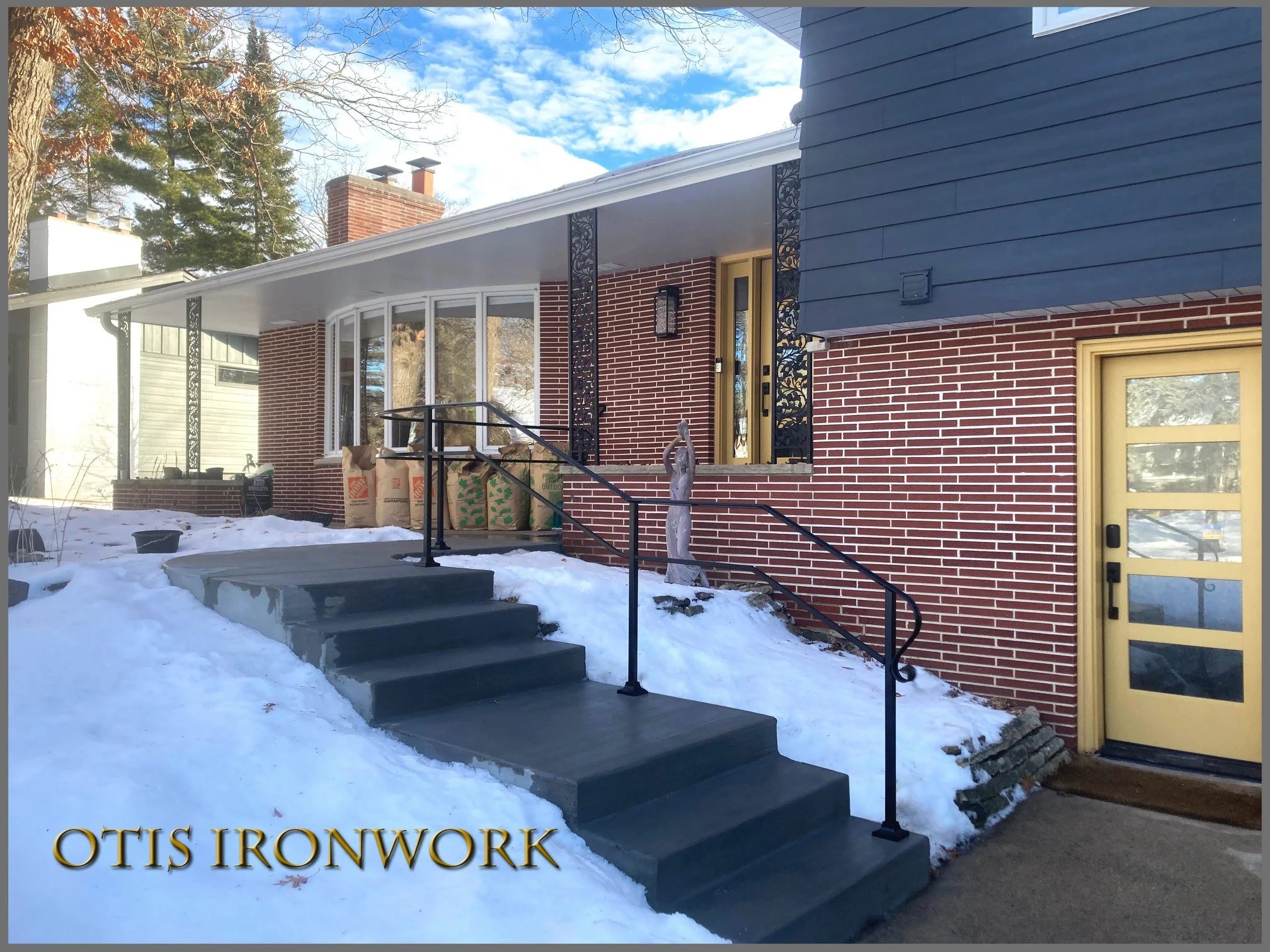 Custom curved handrail handcrafted by Otis Ironwork. Welded from quality materials including a durable powder coat paint finish and professional installation. Call Otis Ironwork at 507-995-3745 to get your railing project started.